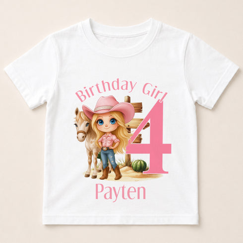 A white t-shirt with a cartoon image of a young girl wearing a cowboy hat and standing next to a horse, along with the text "Birthday Girl 4 Payten".