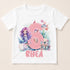 A white t-shirt with a mermaid and underwater theme, featuring the number 6 and the name "Rhea" printed on it.