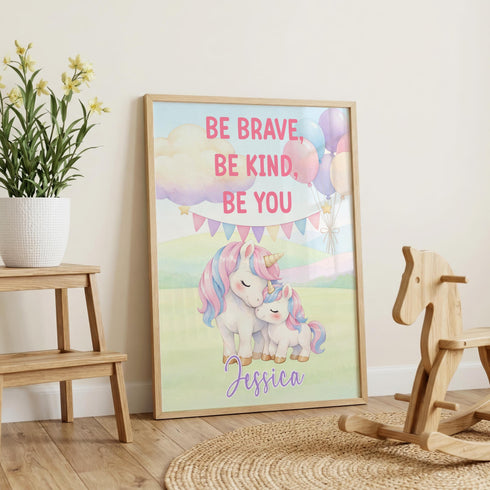 a framed poster with a unicorn and a message encouraging bravery, kindness, and self-confidence.