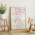 a framed poster with a unicorn and a message encouraging bravery, kindness, and self-confidence.