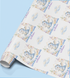 The image is a roll of wrapping paper with a repeating pattern of a blue dragon and clouds, along with the text "Welcome to the World" written on it.