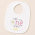 A white baby bib with a printed design and text on it.