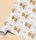 Personalised Golden Retriever birthday wrapping paper featuring a cute puppy, custom name and birthday message with paw prints and dog toys.