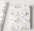 Personalised birthday wrapping paper with butterfly garden design, custom name and age, pastel flowers, soft rainbow colours and pretty birthday wording.
