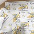 Personalised digger birthday wrapping paper with custom name and age, construction vehicle gift wrap featuring excavator and birthday balloons.