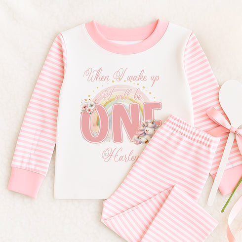 a pink and white striped outfit with a flower