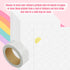 The image is a colorful and vibrant collage featuring a rainbow, stickers, and a roll of tape.