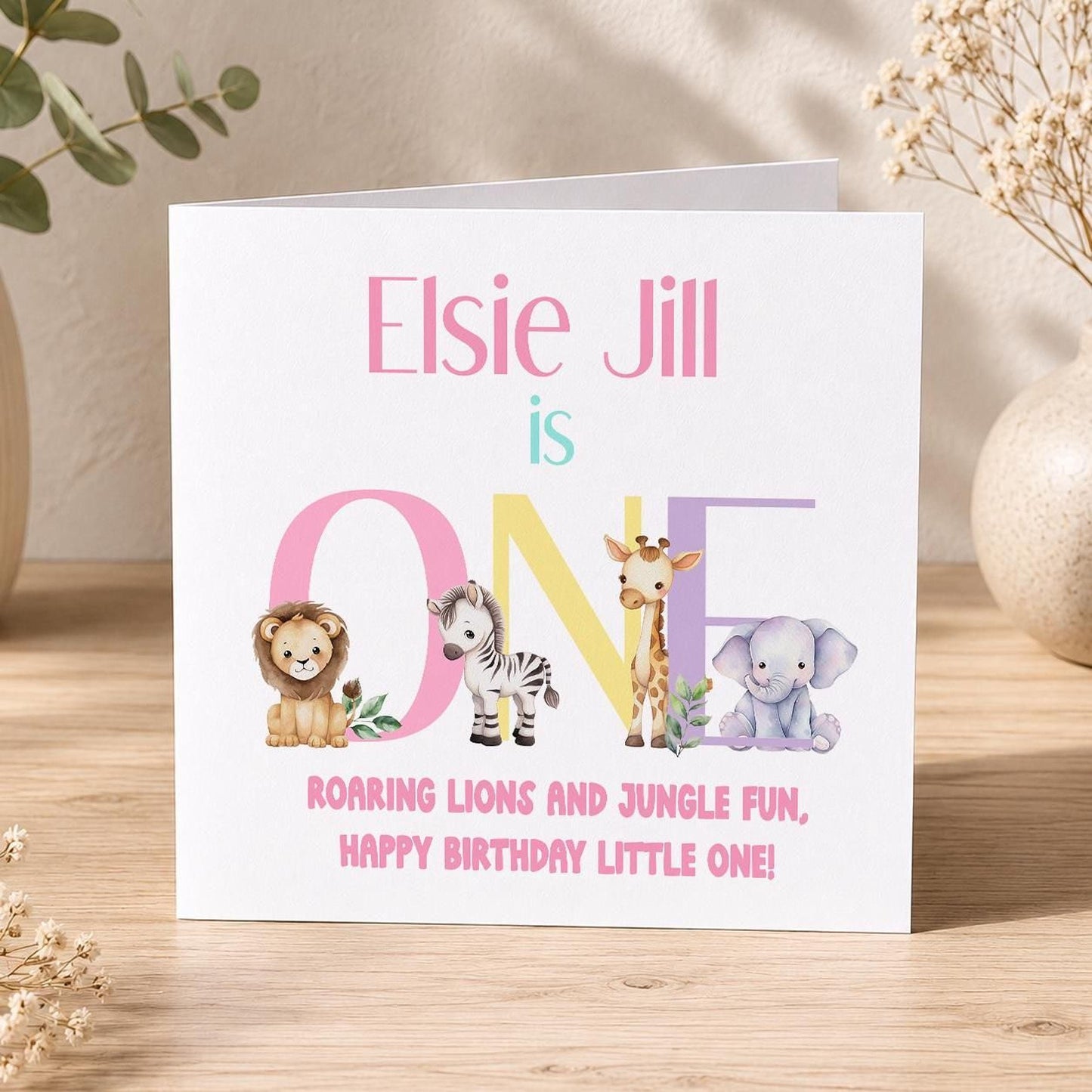 Front view of the personalised safari jungle animals birthday card on a plain background.