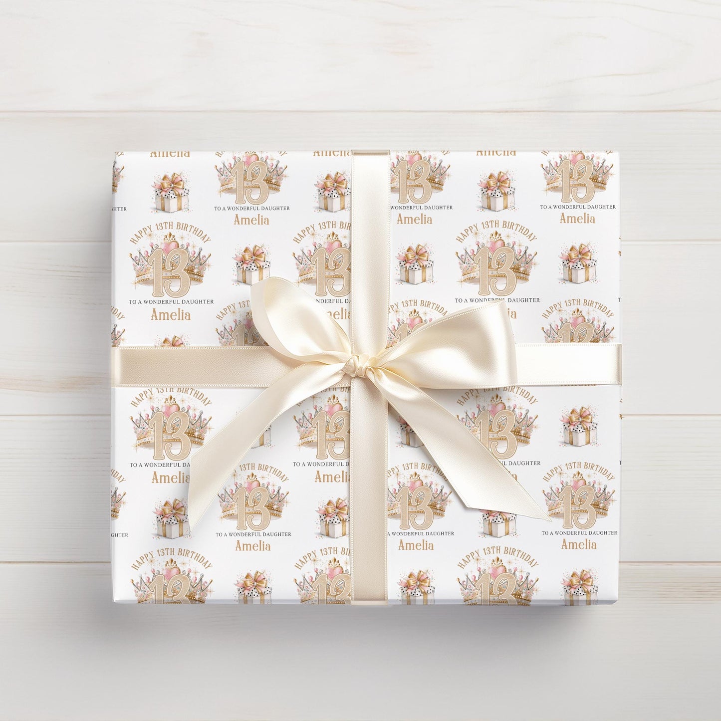 Roll of personalised glitter crown wrapping paper packaged in a postal tube ready for delivery.