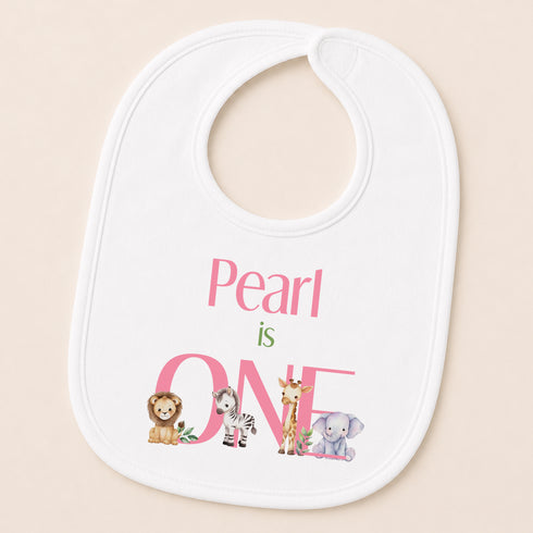 A white baby bib with a pink text and animal illustrations printed on it.