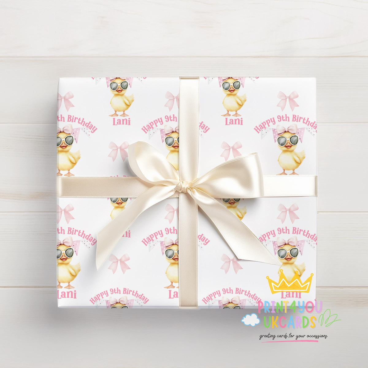 Personalised duck birthday wrapping paper wrapped around a gift