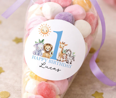 Personalised safari 1st birthday sticker with lion elephant giraffe zebra and blue number one, jungle party bag label for boys