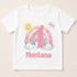 A white t-shirt with a colorful graphic design featuring a sun, clouds, and a rainbow, along with the number 4 and the text "Montana" below it.