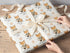 Printed christmas wrapping paper shown as wrapping paper