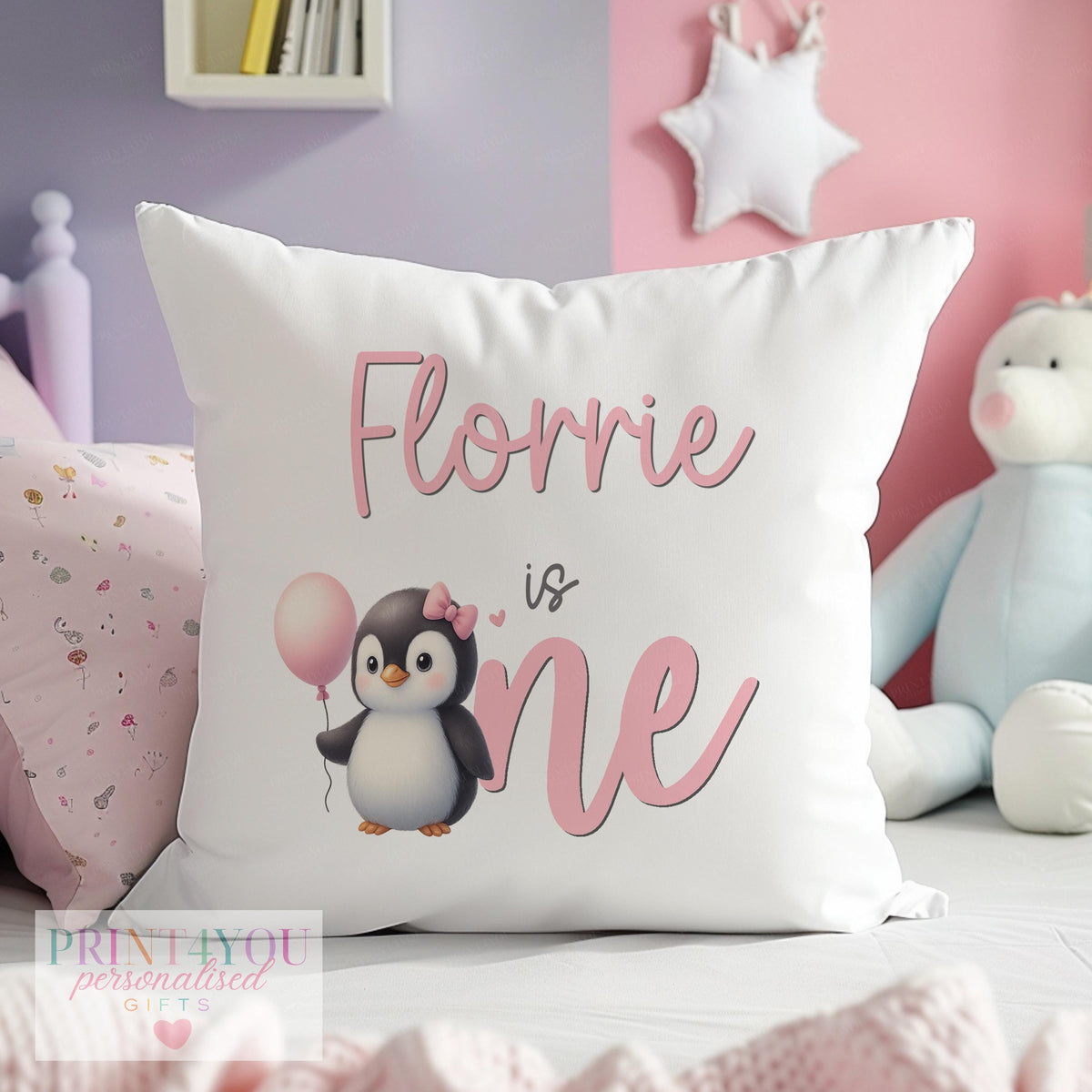 Personalised pink penguin birthday cushion with custom baby name, shown as the cushion cover only