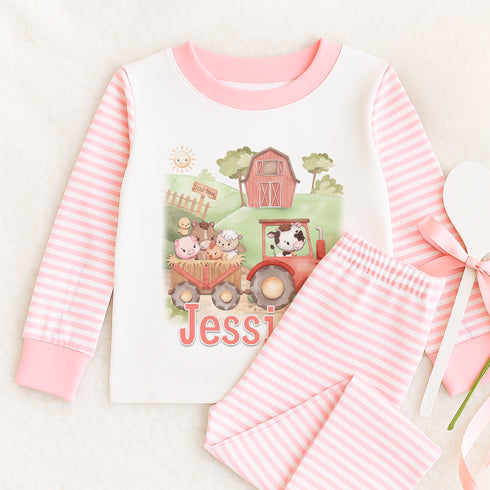 a pink and white outfit with a cow on it