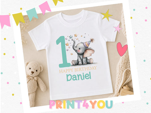 Personalised first birthday t-shirt with elephant design, styled with a teddy bear and birthday decorations