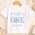 A white t-shirt with a blue elephant graphic and text that says "When I wake up I will be ONE Lucas Jack" printed on it.