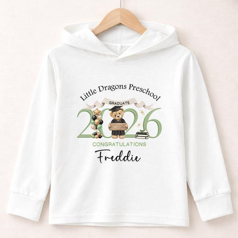 White lightweight hooded long-sleeved children’s top featuring a personalised green teddy bear preschool graduation 2026 design.