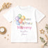 Personalised Happy Birthday Mummy children's white t-shirt with colourful balloon design and custom message displayed on a neutral styled background