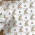 Personalised teddy bear 1st birthday wrapping paper for son featuring custom name, green balloons and first birthday design.