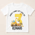 A white t-shirt with a graphic design featuring a yellow construction vehicle and the text "When I wake up I will be 3 Ronnie".
