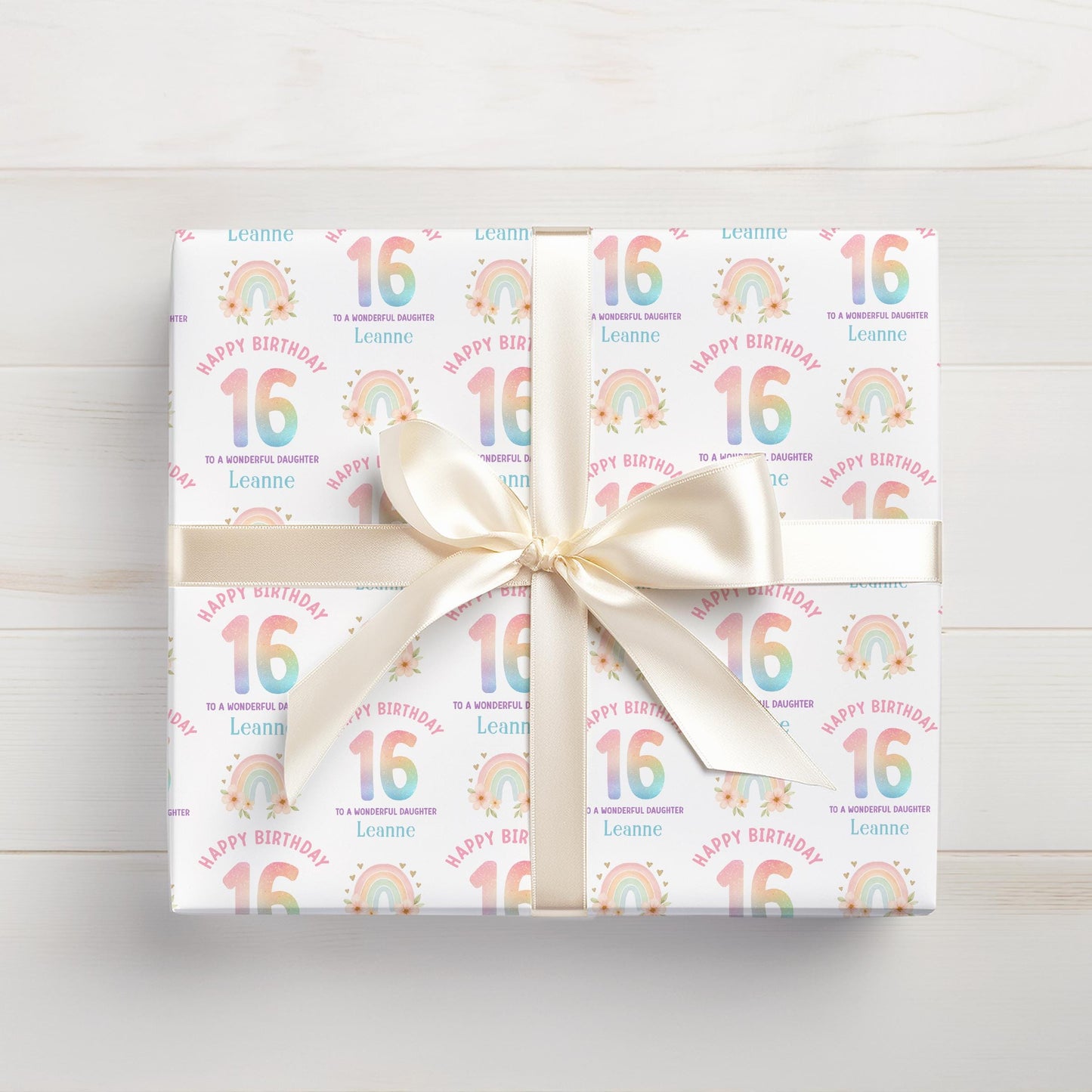 Roll of personalised rainbow wrapping paper packaged in a postal tube ready for delivery.