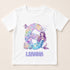 A white t-shirt with a design featuring a mermaid character and the number 6.