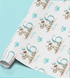 A roll of wrapping paper with a repeating pattern of a dog wearing a party hat and holding a gift, along with the number 6 and paw prints.