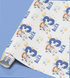 The image is a roll of wrapping paper with a repeating pattern of a young boy wearing a spacesuit and the name "Alex" written on it.