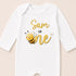 A white onesie with a yellow bee and the text "Sam is one" printed on it.