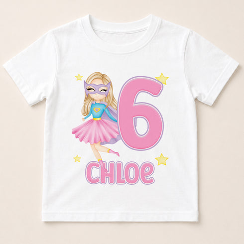 A white t-shirt with a graphic design featuring a cartoon girl wearing a superhero costume and the number 6, along with the name " Chloe" written below.
