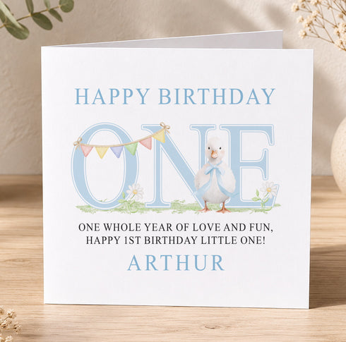 A birthday card for Arthur's first birthday, featuring a cute duck and colorful flags.