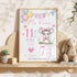 Personalised mouse baby birth stats poster with pastel balloons, bunting, pink and purple details, custom baby name, date, time, length and weight, shown framed in a nursery.