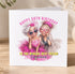 A birthday card with two women wearing sunglasses and a pink tutu, celebrating their 50th birthday.