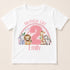 A white t-shirt with a pink graphic design featuring a large number "2" surrounded by various animals, including a lion, giraffe, zebra, and elephant. The text "Birthday Girl Emily" is written above the graphic.