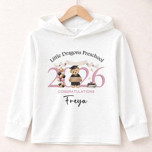 White lightweight hooded long-sleeved children’s top with a personalised pink teddy bear preschool graduation 2026 design.