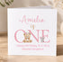 The image is a birthday card for a girl named Amelia, featuring a teddy bear and a mouse, with the text "Amelia is ONE Happy Birthday To A Very Special Daughter".