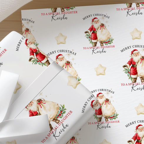Personalised vintage Santa Christmas wrapping paper wrapped around a gift with cream ribbon, featuring a repeating Father Christmas design.