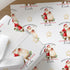 Personalised vintage Santa Christmas wrapping paper wrapped around a gift with cream ribbon, featuring a repeating Father Christmas design.