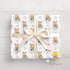 Printed christmas wrapping paper shown as wrapping paper