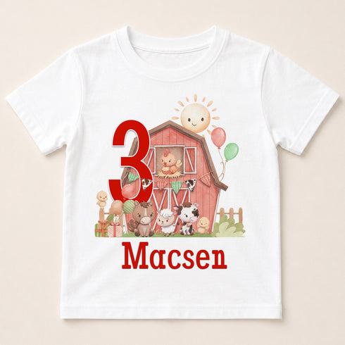 A white t-shirt with a graphic design featuring a barn, farm animals, and a large number 3.