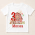 A white t-shirt with a graphic design featuring a barn, farm animals, and a large number 3.