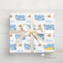 A gift box with a white ribbon tied around it, featuring a repeating pattern of the name "Oliver" and the character Nemo from the movie Finding Nemo.