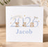A white greeting card with a design featuring three cute animal illustrations and the text "BORN IN 2026 Jacob".