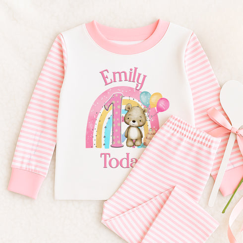 a pink and white shirt with a teddy bear on it