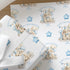 Close-up of personalised first birthday wrapping paper featuring a cute bunny rabbit, blue number one, balloons and presents on premium white wrapping paper.