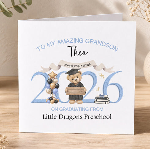 The image is a personalized graduation card for a grandchild named Theo, congratulating him on his graduation from Little Dragons Preschool.