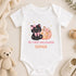 Personalised baby’s first Halloween white vest featuring a cute black kitten with pink bows, a peach pumpkin and stars.