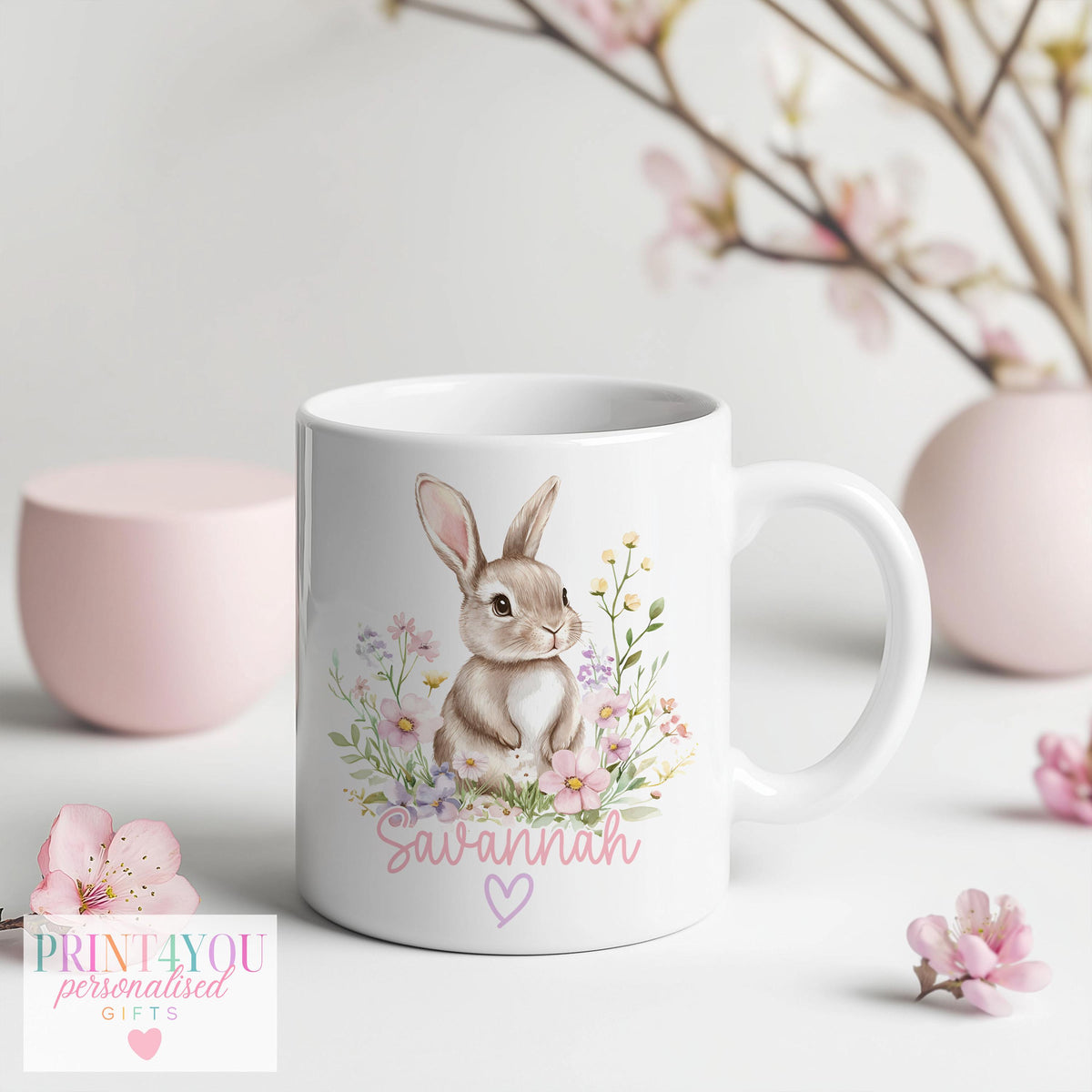 Personalised floral bunny mug shown with the pink handle option
